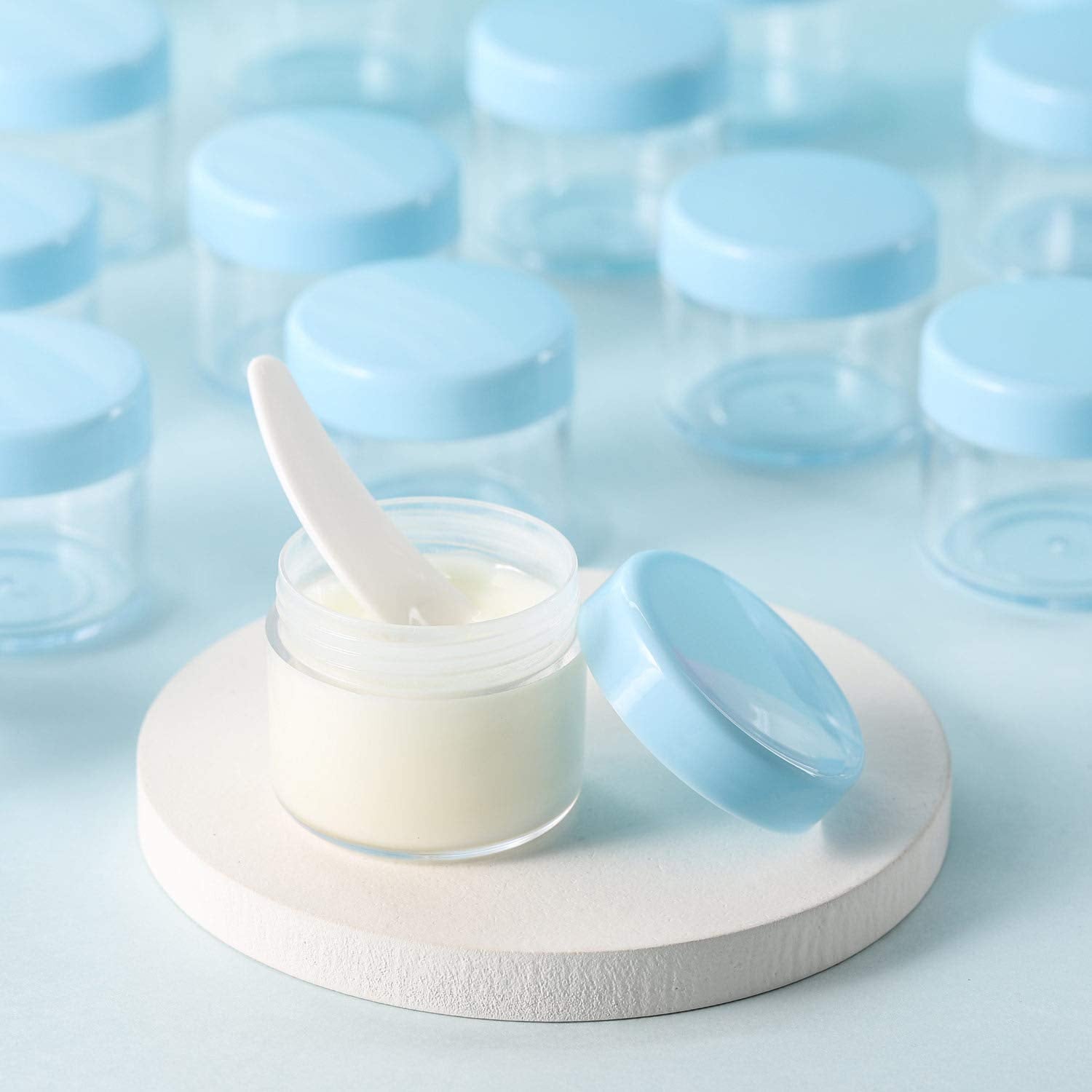 Refillable Cosmetic Sample Jars - 100 Pack 20g (0.7oz) Blue Small Travel Containers with Lids + 10 Mini Makeup Spatulas - BPA Free-BrightBean Baby