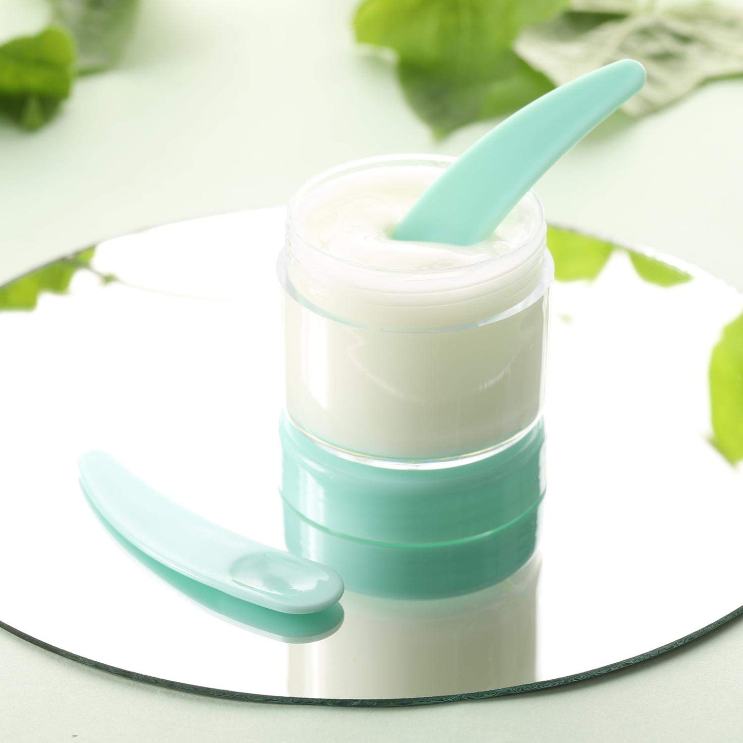 Refillable Cosmetic Sample Jars - 100 Pack 20g (0.7oz) Green Small Travel Containers with Lids + 10 Mini Makeup Spatulas - BPA Free-BrightBean Baby