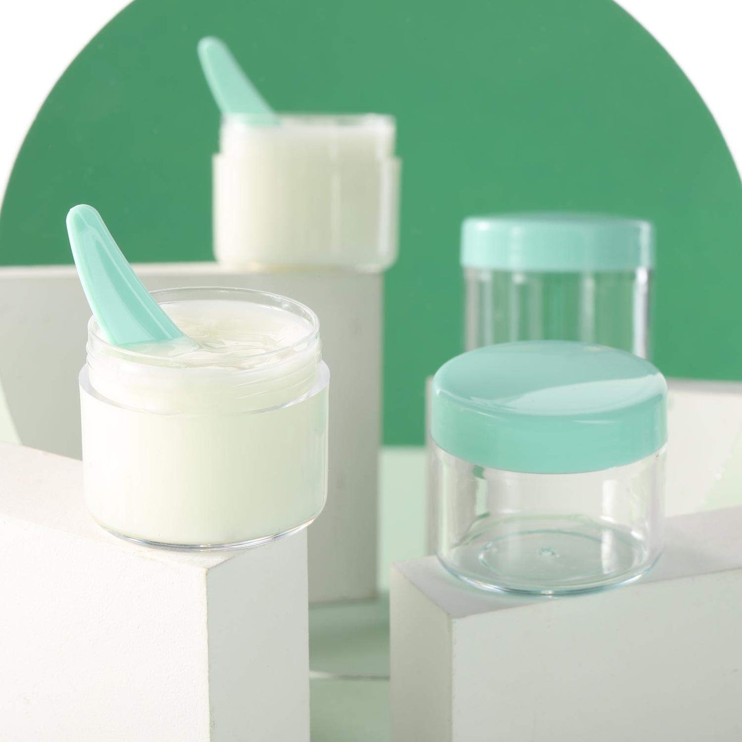 Refillable Cosmetic Sample Jars - 100 Pack 20g (0.7oz) Green Small Travel Containers with Lids + 10 Mini Makeup Spatulas - BPA Free-BrightBean Baby