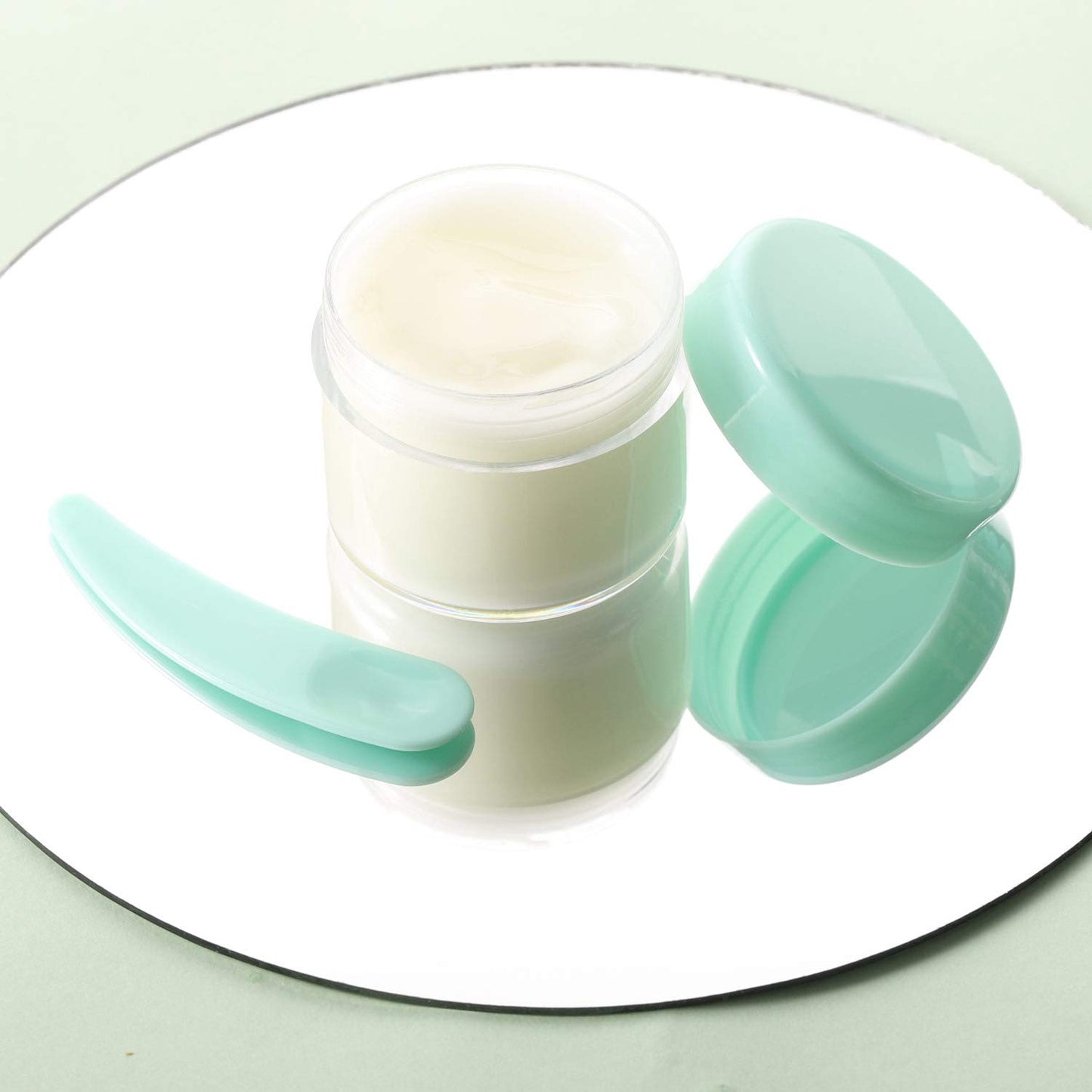 Refillable Cosmetic Sample Jars - 100 Pack 20g (0.7oz) Green Small Travel Containers with Lids + 10 Mini Makeup Spatulas - BPA Free-BrightBean Baby